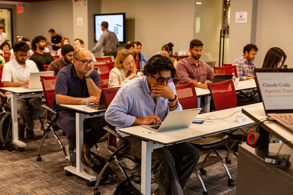 Attendees working through the Claude Code session at New York Tech Week.